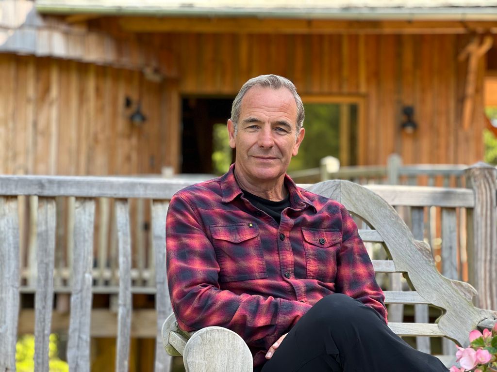 Robson sitting outside the treehouse on Weekend Escapes