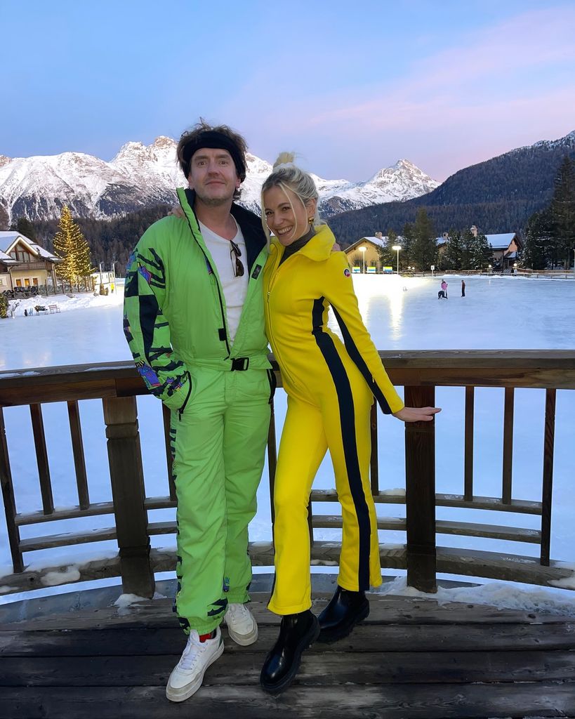 Pixie Lott and Oliver Cheshire in bright ski clothes 