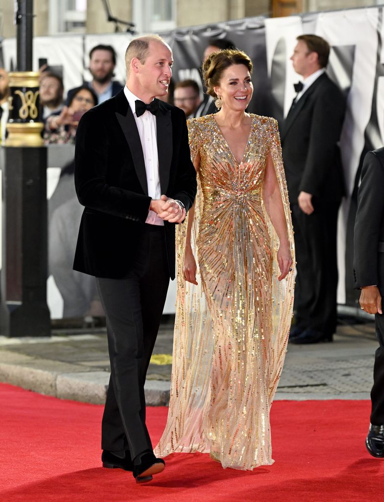 Princess Kate on red carpet with william in gold dress