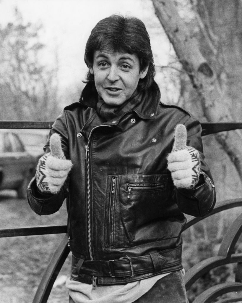 Musician Paul McCartney gives a thumbs up to the press at his farmhouse near Rye, Sussex, after being deported from Japan for bringing drugs into the country on a concert tour with his group Wings, 28th January 1980. McCartney spent nine days in prison in Japan. (Photo by Keystone/Hulton Archive/Getty Images)