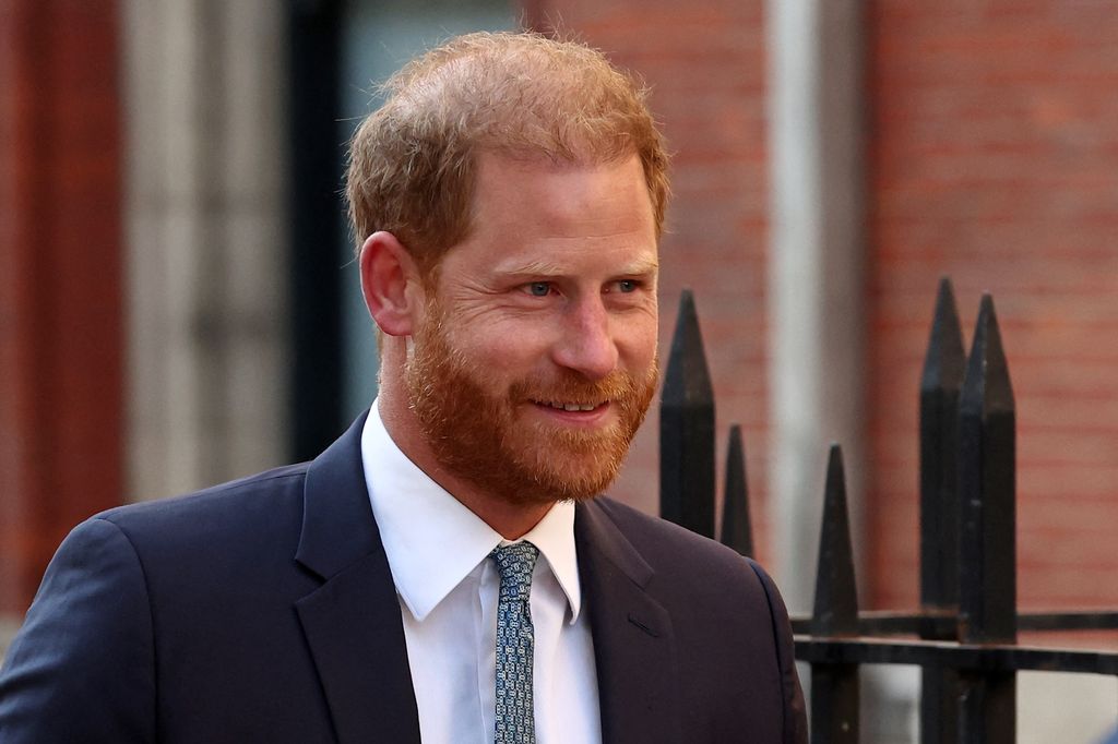 Prince Harry smiling in suit