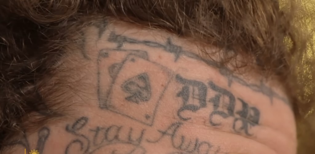 Clip from CBS Sunday Mornings (August 11, 2024) in Which Post Malone showcases his daughter's initials, DDP, tattooed on his forehead