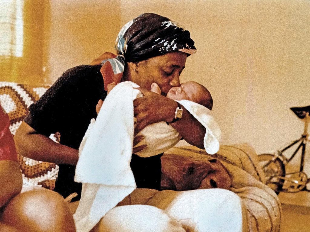 Meghan Markle as baby being cradled by her maternal grandmother Jeanette