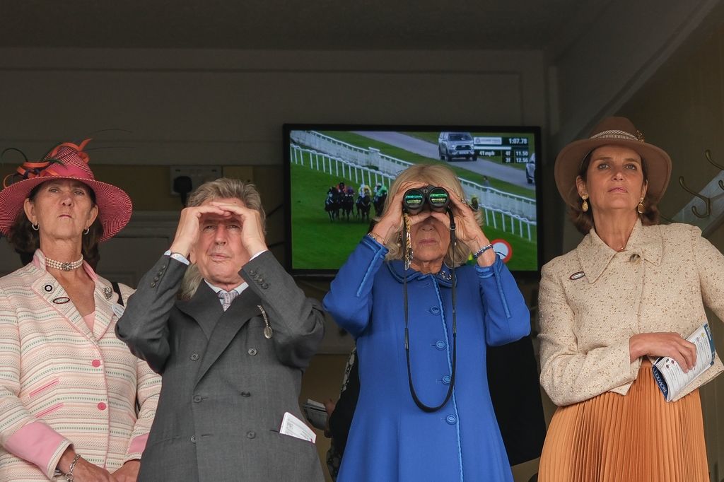 Camilla used her binoculars to get a better look at the races