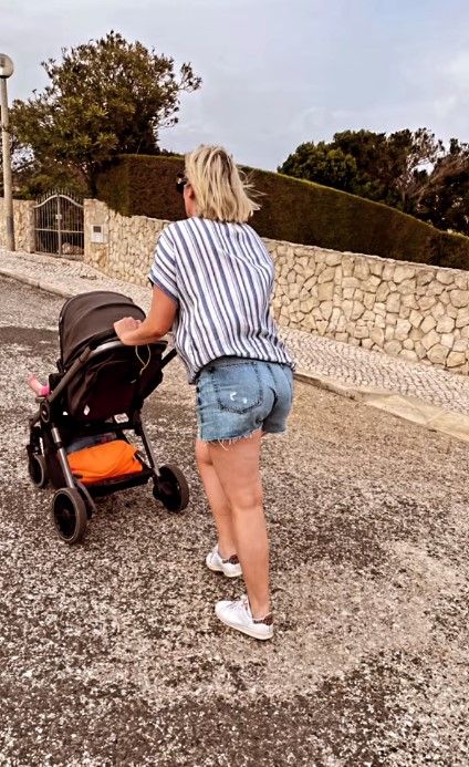 steph mcgovern pushing three year old daughter in pram on family holiday