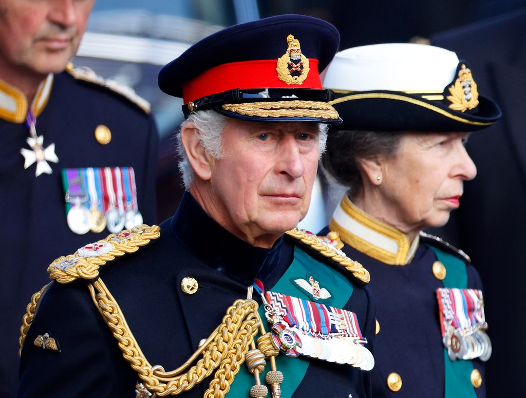 King Charles standing with Princess Anne