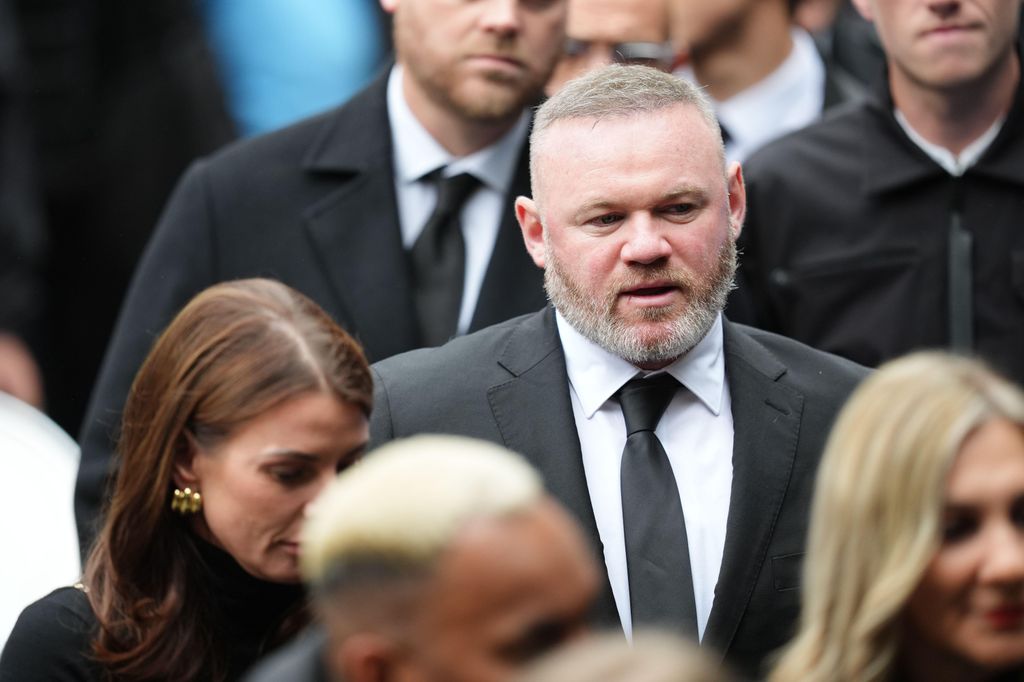 Coleen and Wayne Rooney waiting to go into Manchester Cathedral for the funeral of Ricky Hatton. 