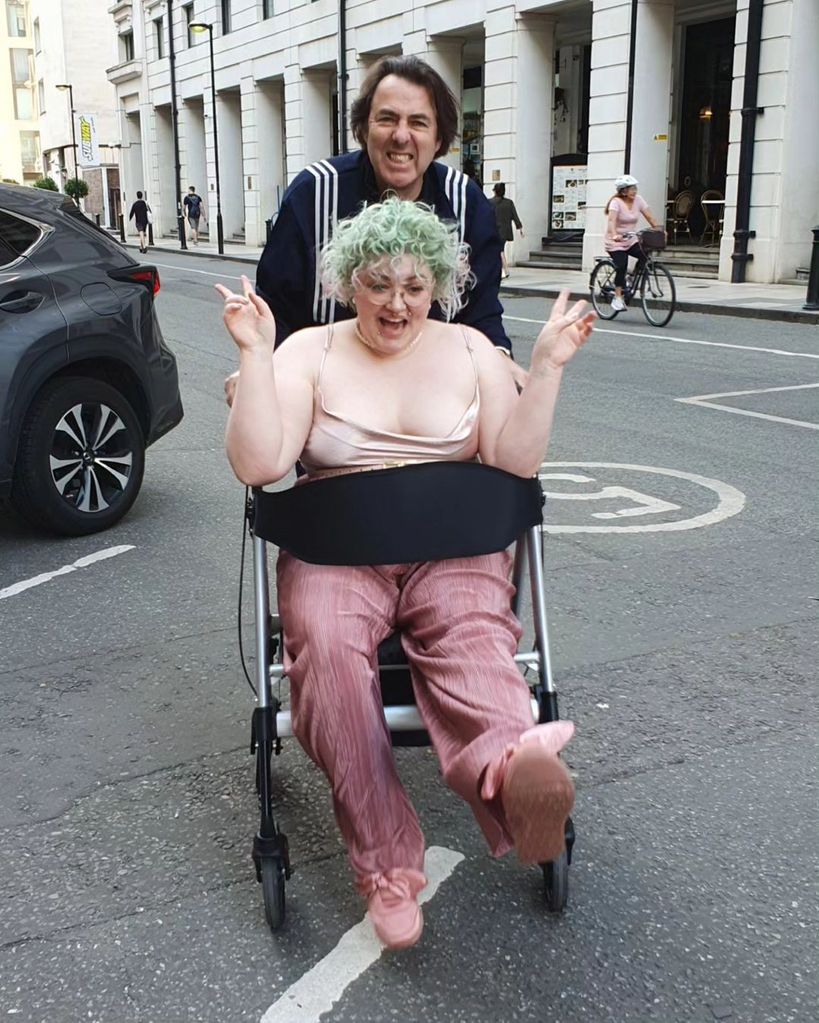 Jonathan Ross pushes his daughter Betty in her wheelchair