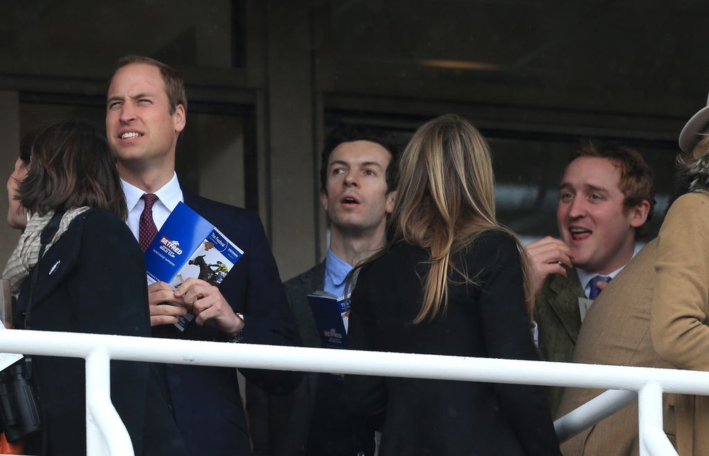 Prince William, another man, and Harry Aubrey-Fletcher watching a horse race