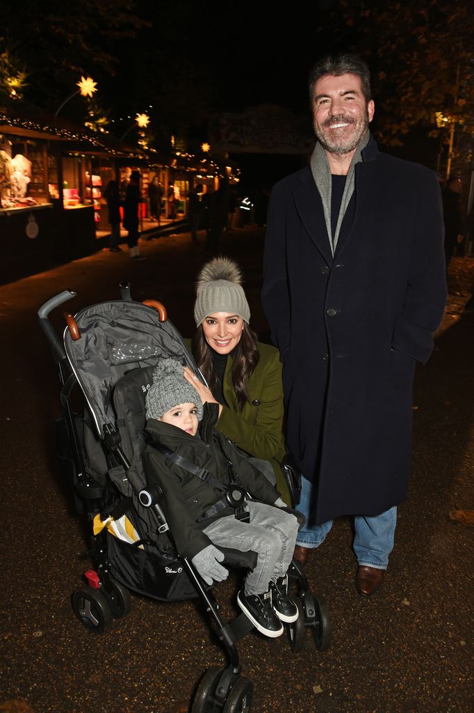 Simon Cowell (R) with Lauren Silverman and son Eric Cowell attend a VIP Preview of Hyde Park's Winter Wonderland 2016 on November 17, 2016 in London, United Kingdom.