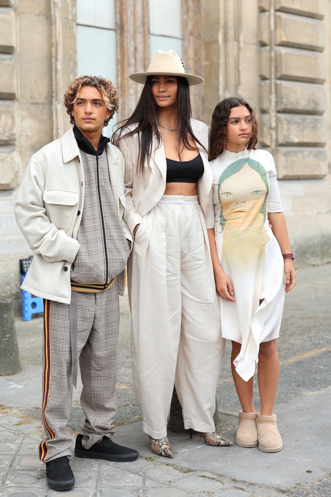 Camila Alves McConaughey (C) with son Levi Alves McConaughey (L) and daughter Vida Alves McConaughey (R) attend the Stella McCartney Womenswear Fall Winter 2023-2024 show as part of Paris Fashion Week on March 06, 2023