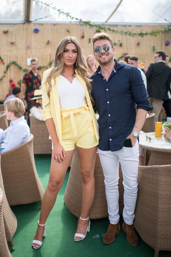 Zara McDermott in a yellow short suit and Sam Thompson in a blue shirt and sunglasses