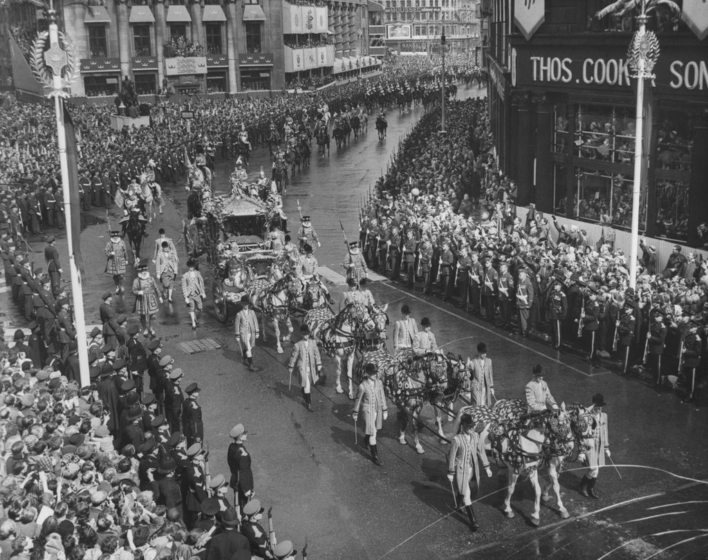 Crowds lining Pall Mall as Queen Elizabeth II passes on the way to her coronation ceremony.  