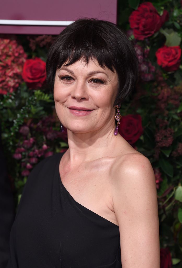 Helen McCrory wearing a black dress