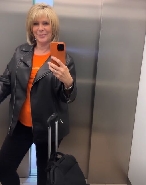 Ruth Langsford standing in an elevator in a leather jacket