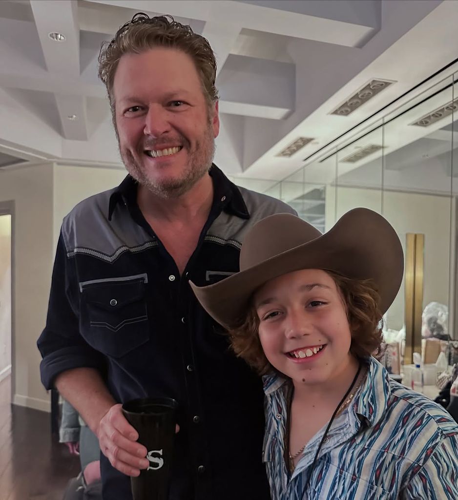 Blake Shelton and his son Apollo pose for a photo in a dressing room, shared on Instagram