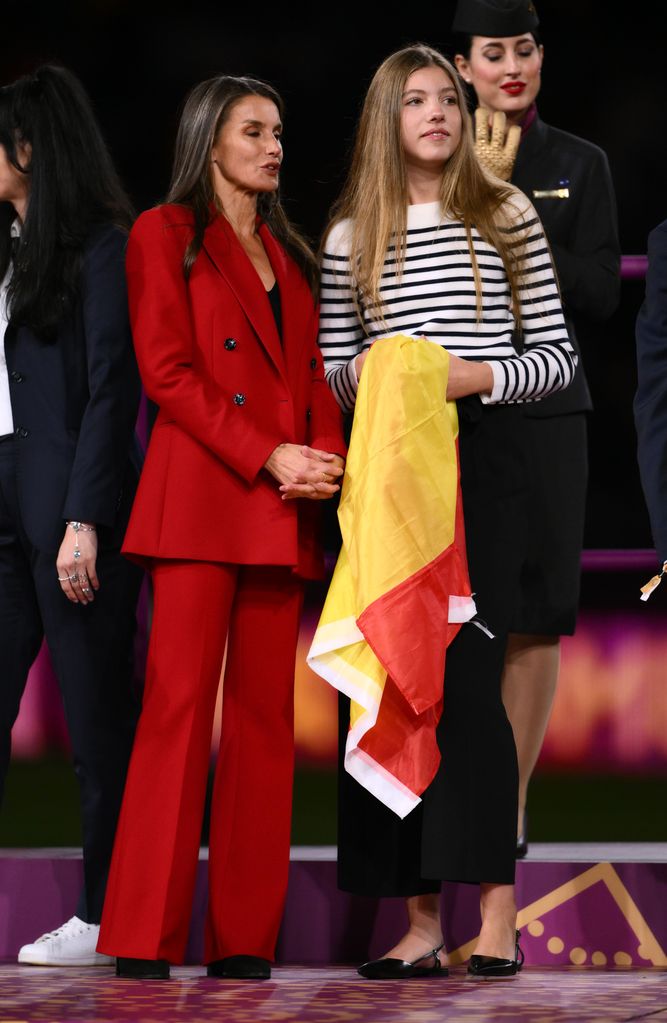 queen letizia in red suit with daughter at women's world cup