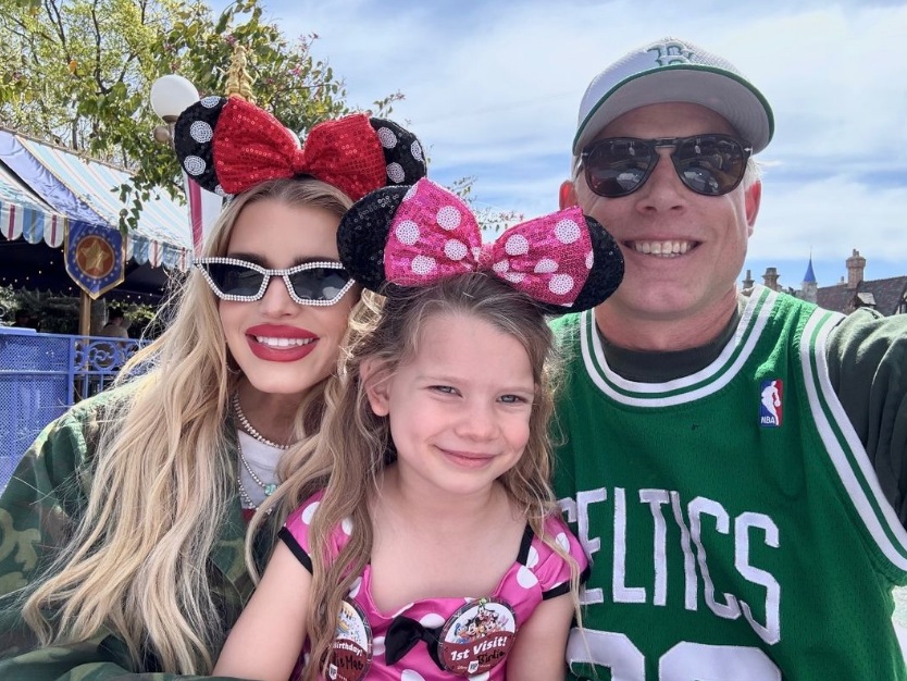 Photo shared by Jessica Simpson to her Instagram Stories March 2024, posing with her husband Eric Johnson and their daughter Birdie Mae, who was celebrating her 5th birthday at Disney