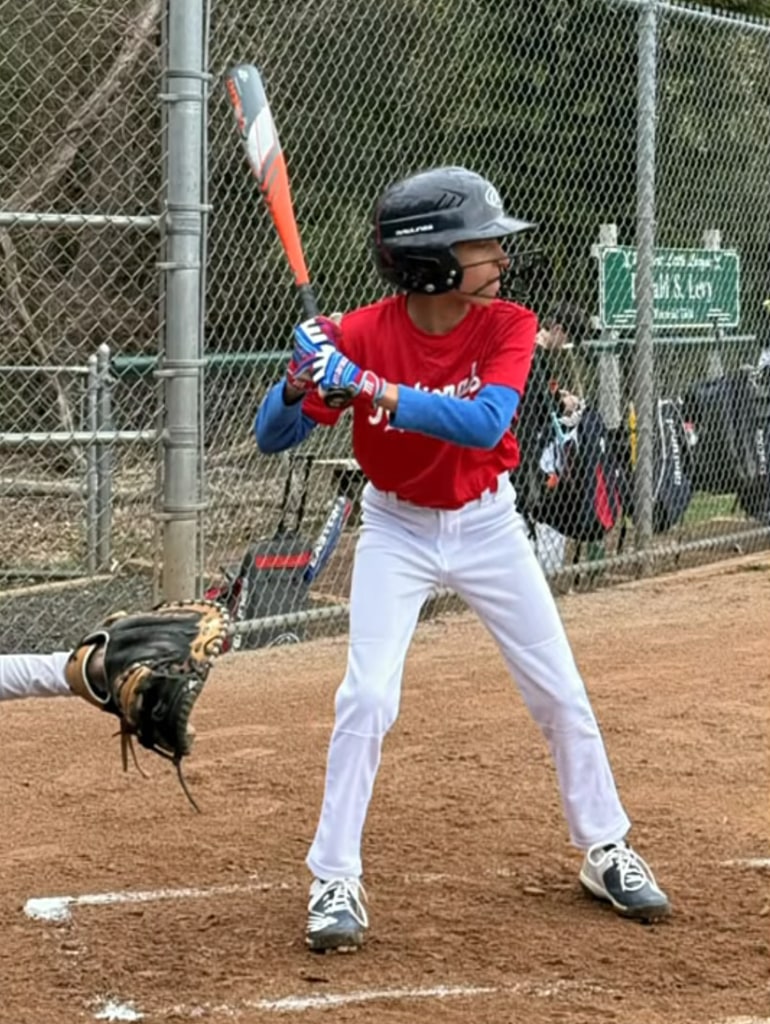 Photo shared by Craig Melvin on TODAY's 3rd Hour April 7 of his so Delano at bat during his first Little League baseball game