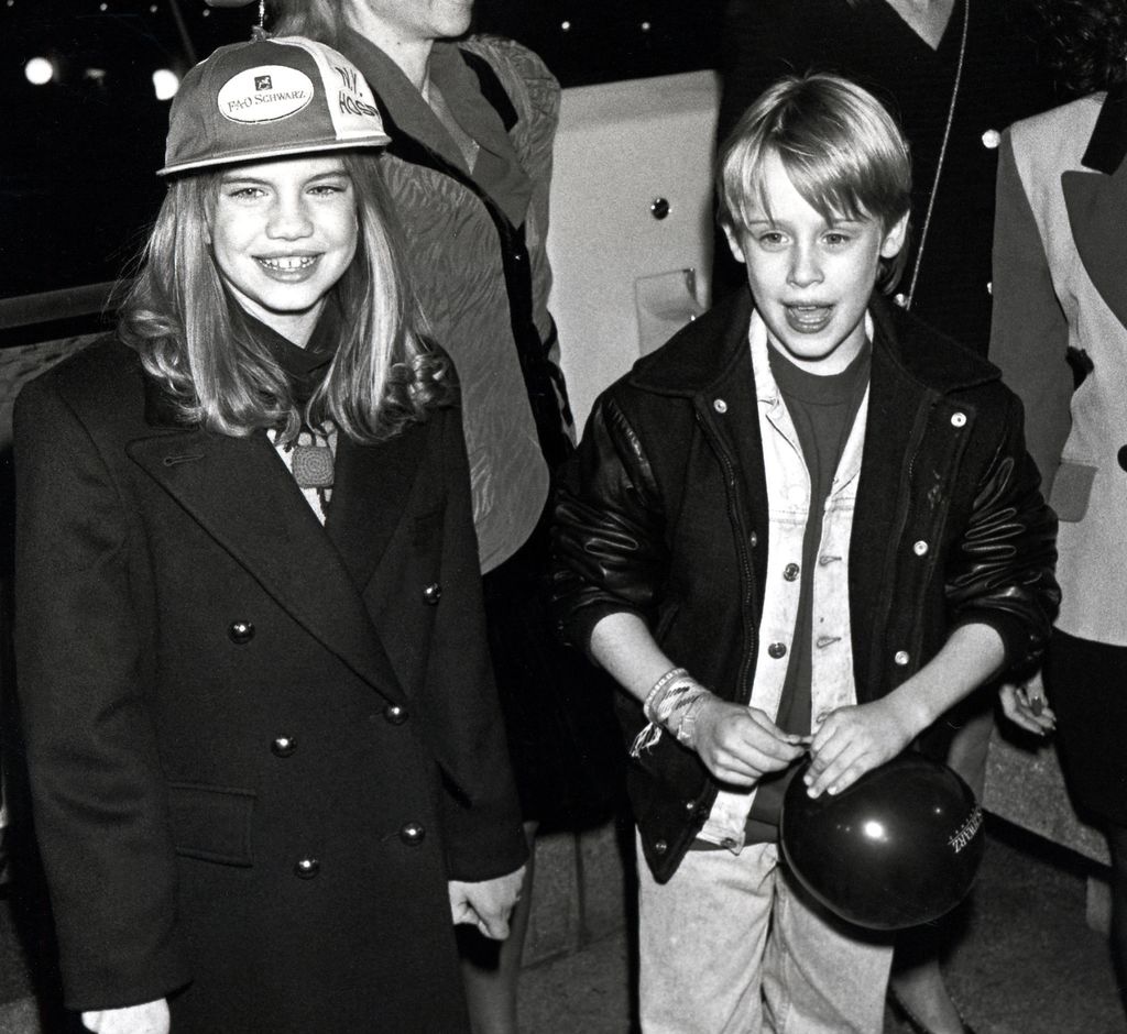 Anna Chlumsky with her My Girl co-star Macauley Culkin in black and white photo