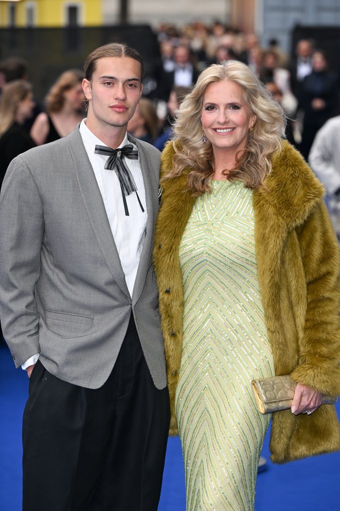 mother and son posing at premiere 