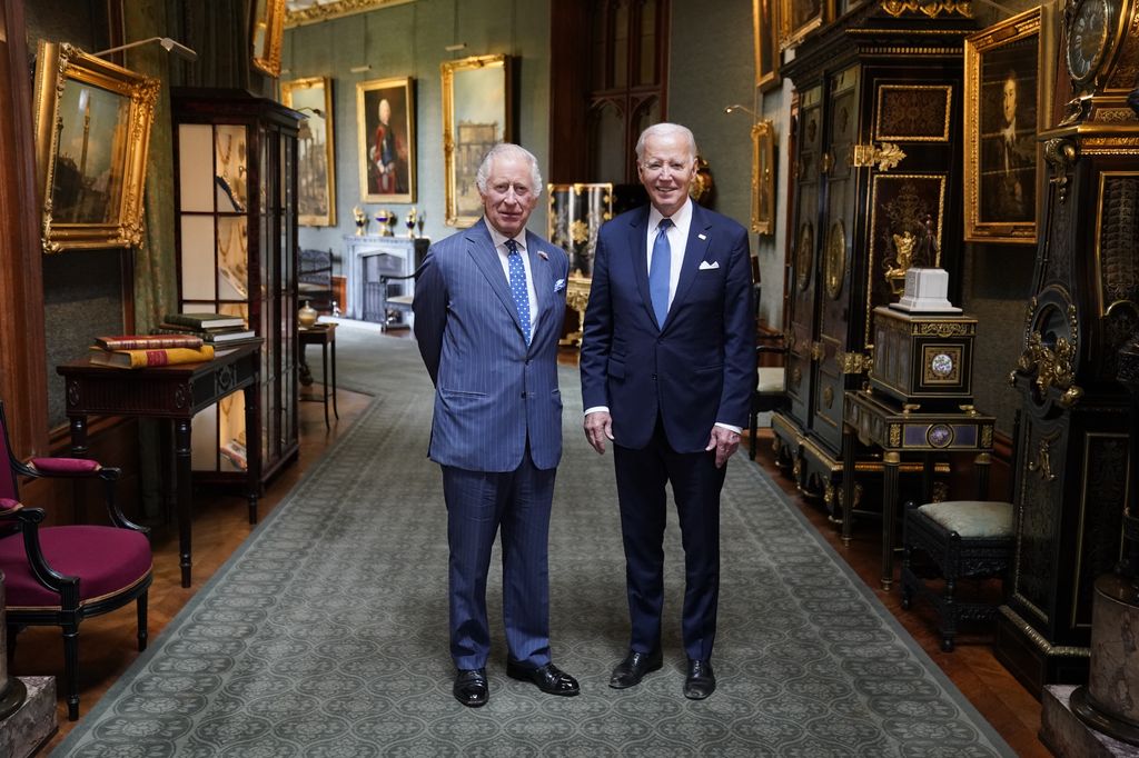 King Charles III and US President Joe Biden pose in the Grand Corridor at Windsor Castle