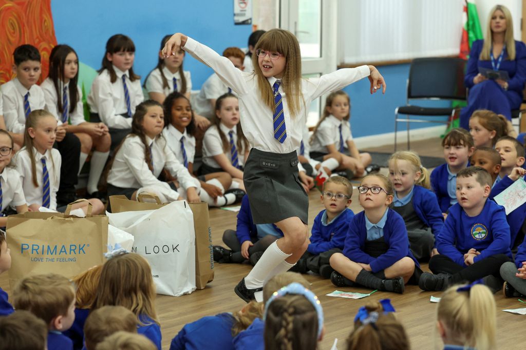 Pupil Ruby Davies performs for Prince William during his visit at Swiss Valley Community Primary School