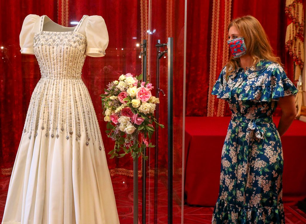 Princess Beatrice looking at her wedding dress
