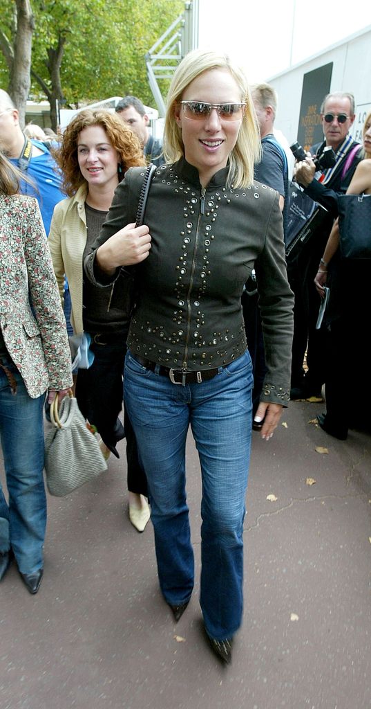 zara walking through crowd in jeans