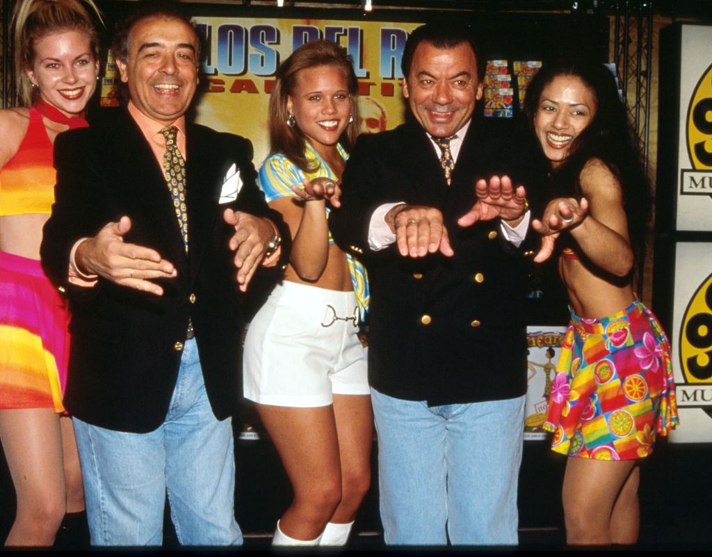 Los Del Rio's Raphael Ruiz and Antonio Romero stand with dancers at a Coconuts music store October 15, 1996 in New York City. Los Del Rio had recorded over 30 albums of traditional Spanish music, until they recorded the worldwide smash hit the "Macarena" which made Billboard's Hot 100 chart for seven weeks. (Photo by Evan Agostini/Liaison)