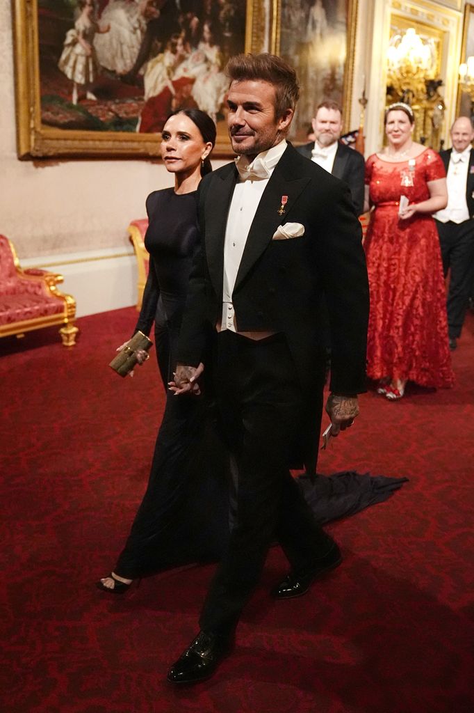 Victoria Beckham and Britain's former football player David Beckham arrive for a State Banquet at Buckingham Palace in London on December 3, 2024, on the first day of the Emir of Qatar's two-day State Visit to Britain.