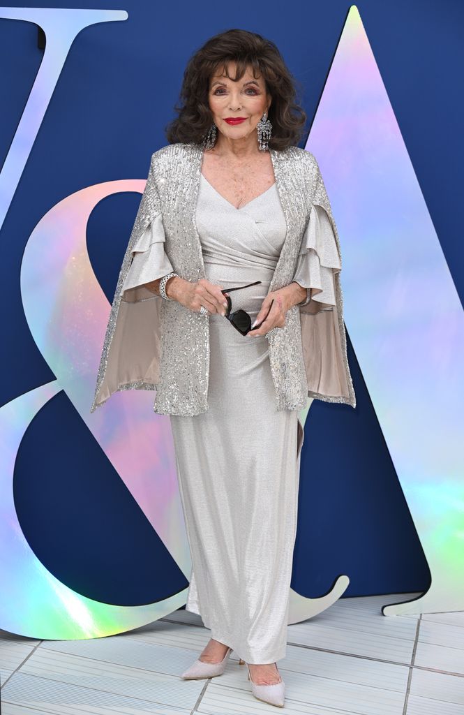 Joan Collins in silver gown with jacket