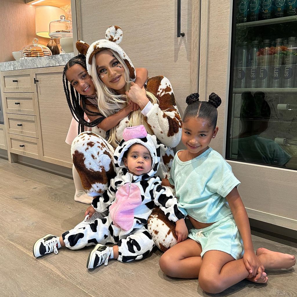 Khloe Kardashian dressed as a cow with her kids