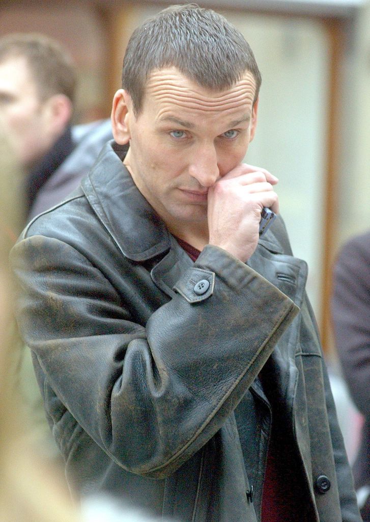 Christopher Eccleston in character as The Doctor in a leather jacket