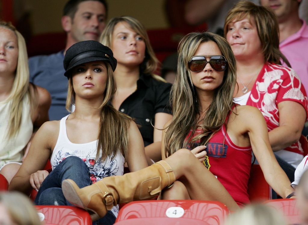 Victoria Beckham sits in the stands to watch David Beckham play football