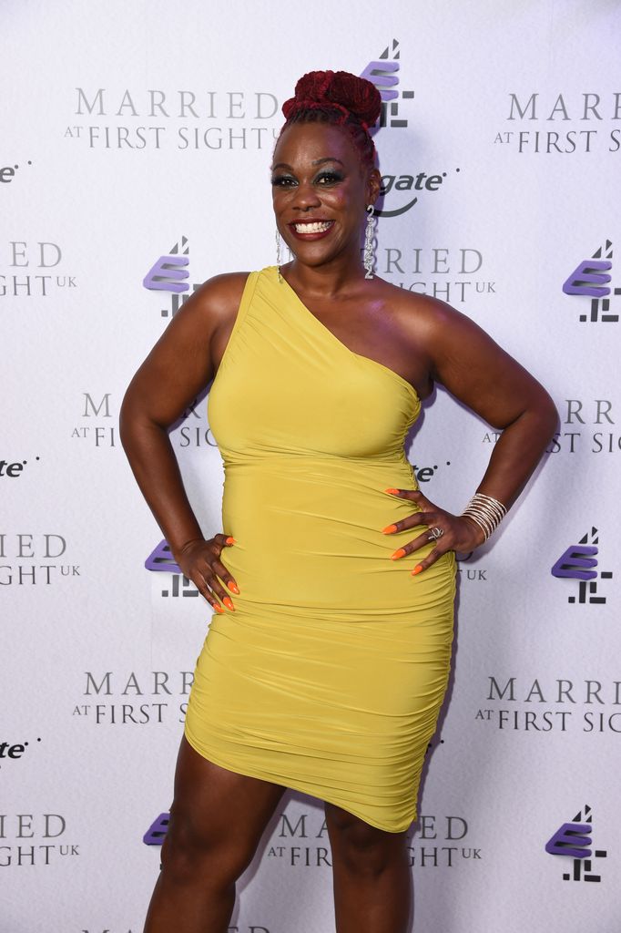 Charlene Douglas in a one shoulder yellow dress