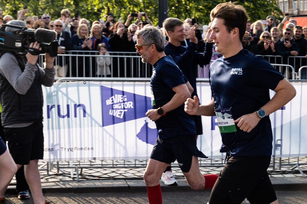 King Frederik X (L) and Crown Prince Christian (R) run the "10 km" during the Royal Run