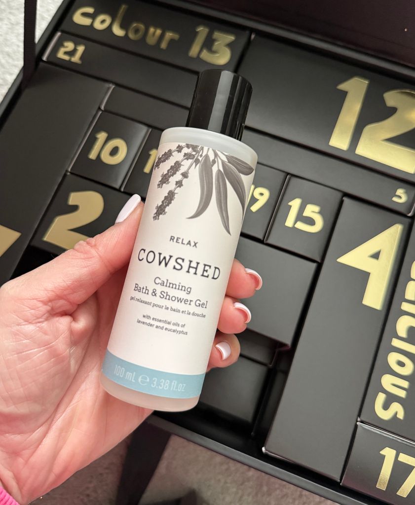 Leanne Bayley holding the Cowshed product inside the M&S Beauty Advent Calendar