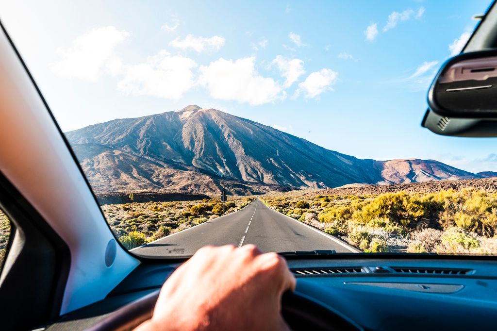 Personal perspective of person driving car towards Teide volcano, Tenerife.