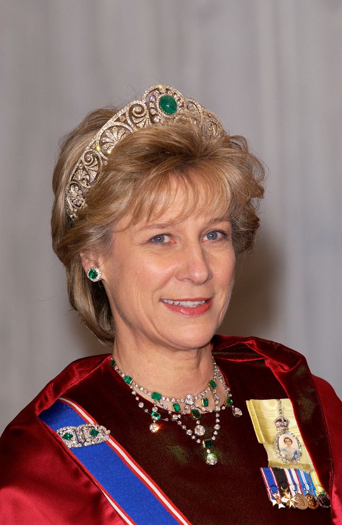 Duchess of Gloucester wearing Queen Mary's Honeysuckle tiara with emerald