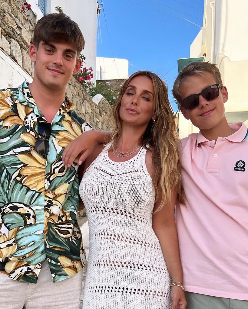 Louise smiling alongside sons Charley and Beau 