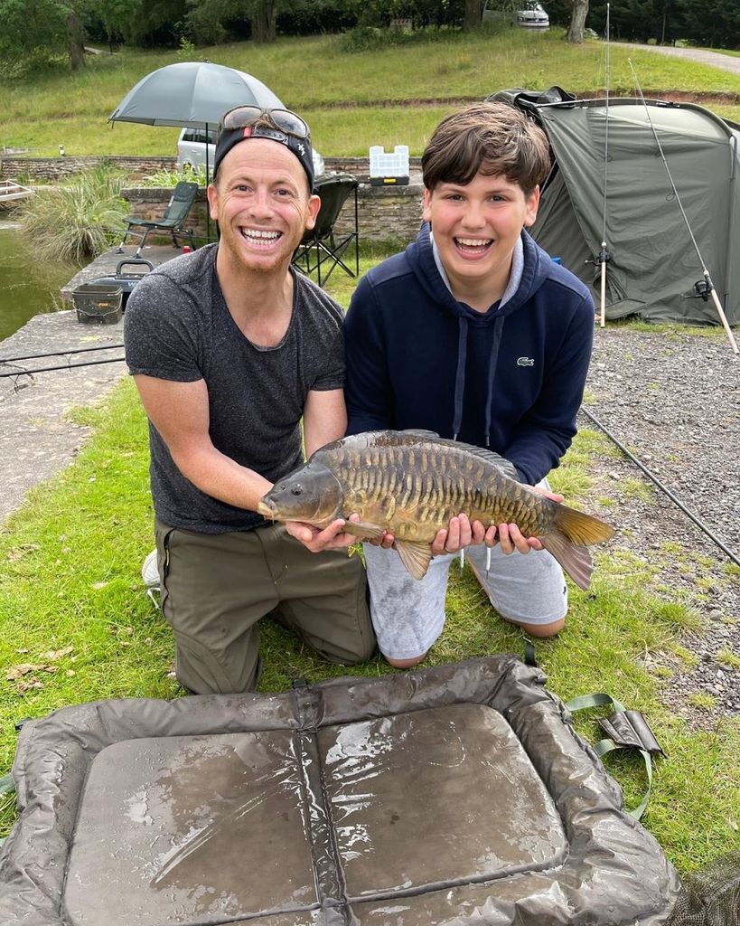 Harry and Joe holding fish