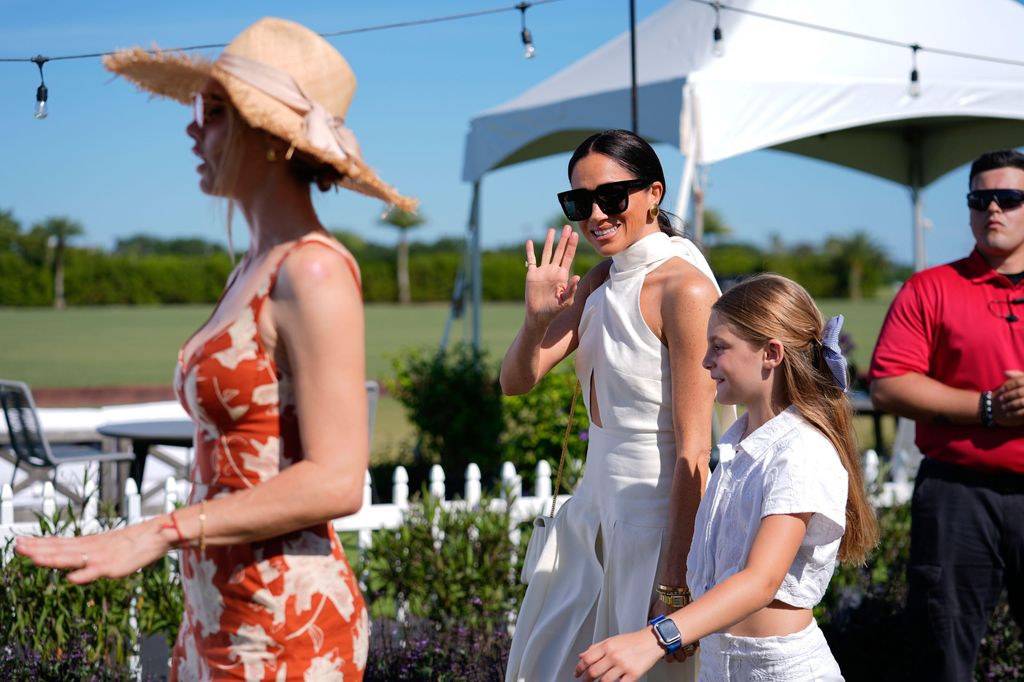 The Duchess waved whilst holding hands with Nacho and Delphine's daughter