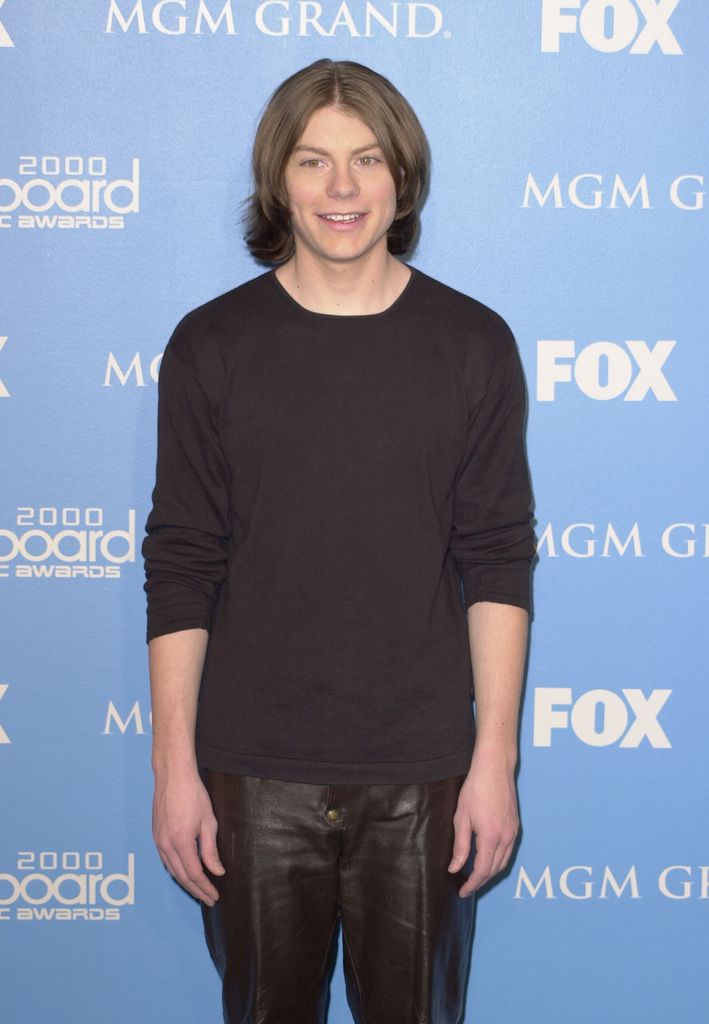 Patrick Fugit wearing a black shirt and black jeans