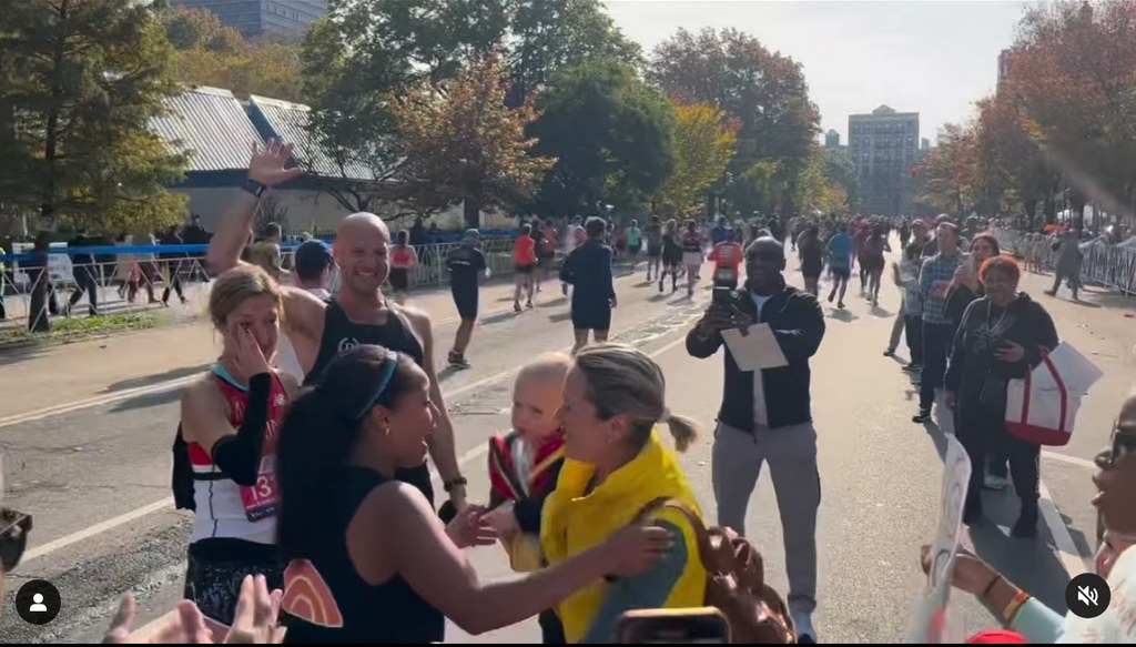 Dylan Dreyer with her young son Rusty cheering on Sheinelle at the New York Marathon