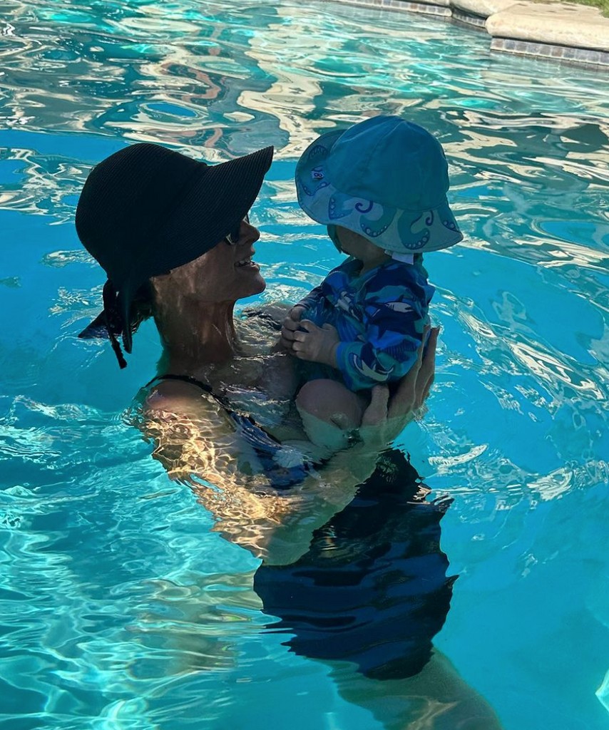 Photo shared by Paris Hilton on Instagram September 2023 of her Labor Day Weekend, where she is in the pool carrying her son Phoenix.