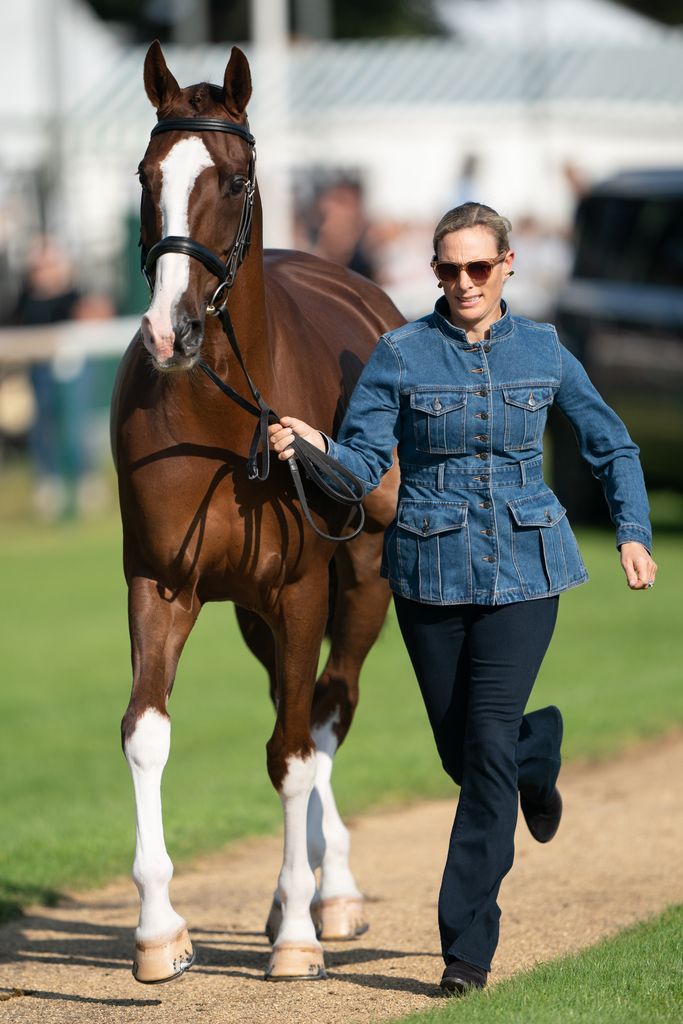 Zara Tindall runs with her horse Class Affair
