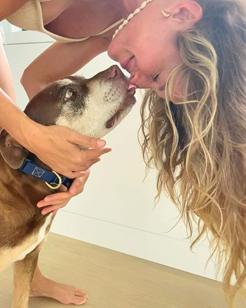 Gisele Bundchen rubs noses with her dog on Valentines Day