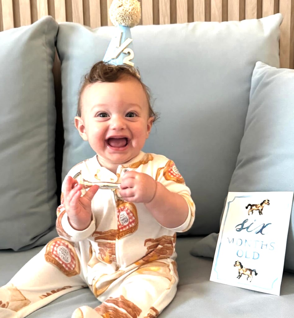 Baby Alexander smiles for the camera