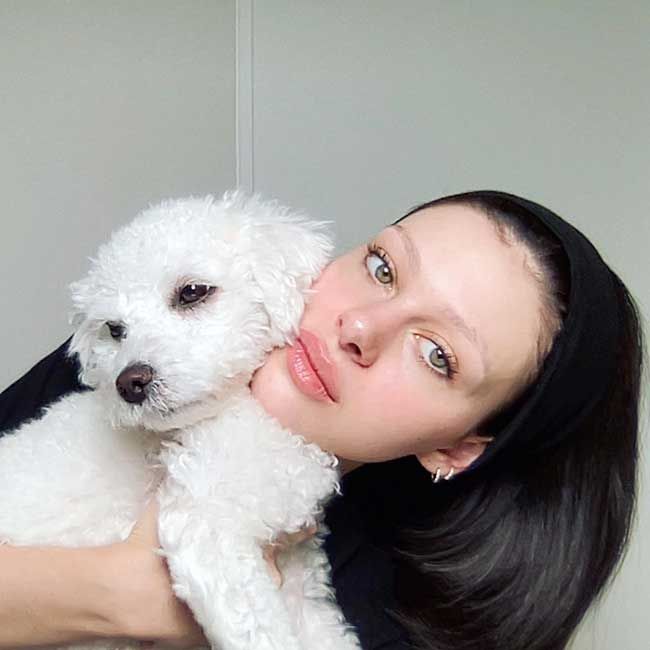 Nicola Peltz with her pet dog